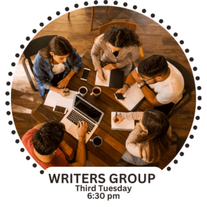 Group sitting with pens, pencils, paper and computer.